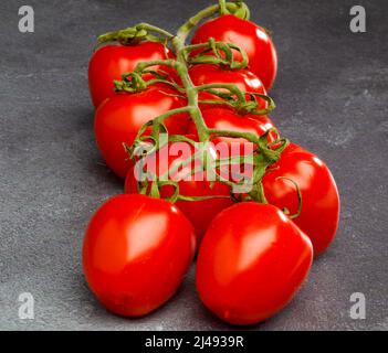 Vine Plum Tomatoes. Stock Photo