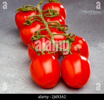 Vine Plum Tomatoes. Stock Photo