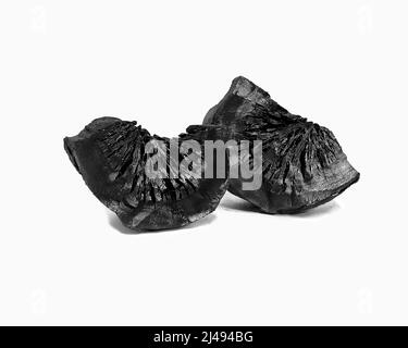 natural charcoal hardwood charcoal on a white background. Stock Photo