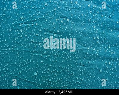 Water drops on waterproof membrane fabric. Morning dew on tent. Stock Photo