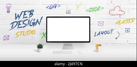 Web design studio concept with computer display mockup and work desk. Creative web page icons and inscriptions on the brick wall Stock Photo