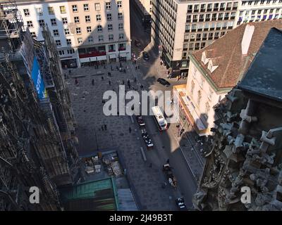 High angle view of popular town square Stephansplatz in the historic center of Vienna, Austria with people and fiacres viewed from Stephansdom. Stock Photo