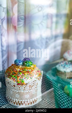 Easter cake and Easter eggs festive celebration table setting traditional decoration and treats. Happy easter holiday on the table meal snack outdoor Stock Photo