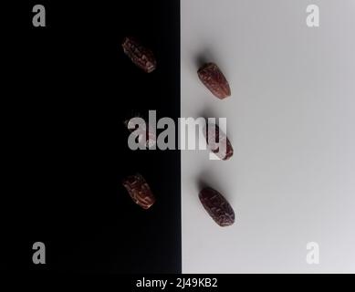 Dates on black and white background, top view of dates Stock Photo