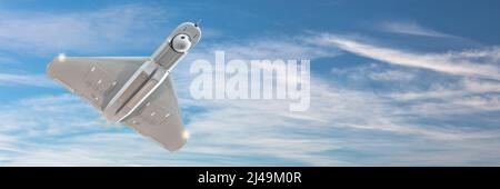 Unmanned military drone on patrol in front of a blue sky with clouds Stock Photo