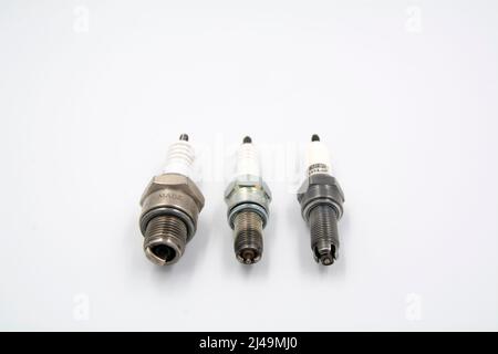 Spark plug types, 1- prong 2-pron and 3-prong spark plug Stock Photo