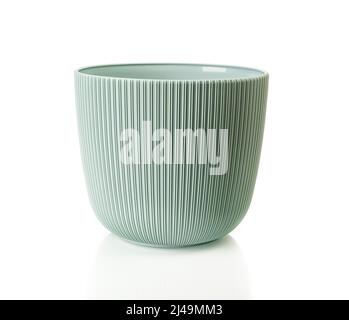 Empty flower pot isolated on a white background. Decorative plant pot cutout. Vertical striped plastic planter for growing indoor plants. Stock Photo