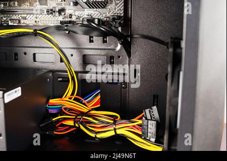 Personal computer power supply. Inside the system unit of a modern computer. Stock Photo