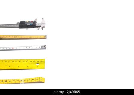 Yellow Measuring tape for tool roulette or ruler. Tape measure template in centimeters. Tapes meter set isolated on black background. Stock Photo