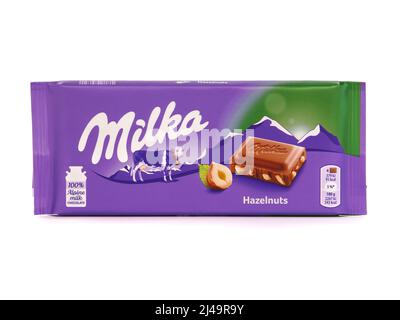 BUCHAREST, ROMANIA - MARCH 9, 2019. Milka alpine milk chocolate bar with hazelnuts isolated on white Stock Photo