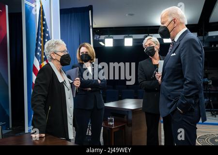 President Joe Biden talks with Climate Adviser Gina McCarthy, Deputy Secretary of Defense Kathleen Hicks, and Energy Secretary Jennifer Granholm after a roundtable on securing critical minerals for a future made in America, Tuesday, February 22, 2022, in the South Court Auditorium in the Eisenhower Executive Office Building at the White House. (Official White House Photo by Adam Schultz) Stock Photo