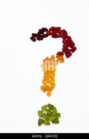 A question mark made of colorful gummy candies on white background Stock Photo