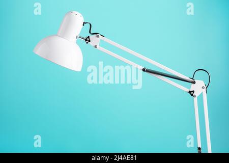 White table office lamp on green background with space for text and idea concept Stock Photo