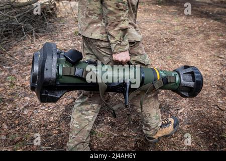 Ukraine. 12th Apr, 2022. A Ukrainian soldier holds the MBT-NLAW (Next generation Light Anti-tank Weapon) provided by the United Kingdom to the Ukrainian army. As Russia retreated from Kyiv Oblast, and now concentrates the offensive in the eastern part of Ukraine, Alexander (48), Sergey (42), Andrew (41), Oleg (31) and their battalion might send to the Eastern part of Ukraine in a few days to join the battle operation. Credit: SOPA Images Limited/Alamy Live News Stock Photo