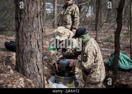 Ukraine. 12th Apr, 2022. Oleg (31) and his comrades seen taking out the MBT-NLAW (Next generation Light Anti-tank Weapon) provided by the United Kingdom. As Russia retreated from Kyiv Oblast, and now concentrates the offensive in the eastern part of Ukraine, Alexander (48), Sergey (42), Andrew (41), Oleg (31) and their battalion might send to the Eastern part of Ukraine in a few days to join the battle operation. Credit: SOPA Images Limited/Alamy Live News Stock Photo