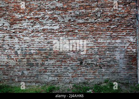 Red brick wall with mortar and cement seepage suitable for wallapers backgrounds or compsite creations. Stock Photo