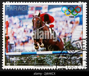 PARAGUAY - CIRCA 1988: a stamp printed in Paraguay shows Hans-Guenter Winkler, West Germany, Equestrian, 1988 Summer Olympics, Seoul, circa 1988 Stock Photo