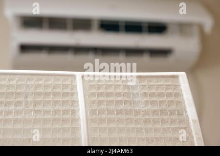Dusty air conditioner filter. A lot of dust on the net, asthma and allergy to dust, cleaning of filters Stock Photo