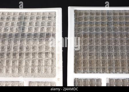 Dirty and clean air conditioner filters. Cleaning the filter from dust, allergies and asthma from dust, maintenance of air conditioners Stock Photo