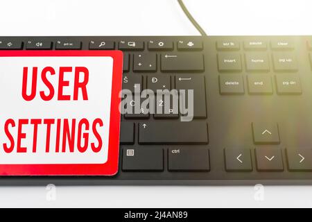 Hand writing sign User Settings. Conceptual photo Configuration of appearance Operating System Personalized Computer Keyboard And Symbol.Information Stock Photo