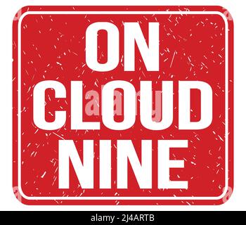 ON CLOUD NINE, text written on red vintage stamp sign Stock Photo