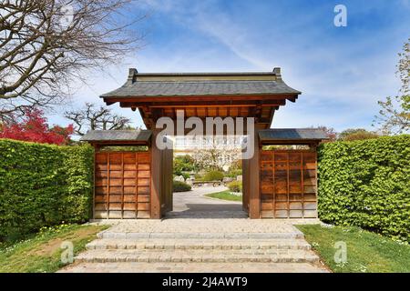 Freiburg, Germany - April 2022: Entrance gate of Japanese garden in public park called 'Seepark' Stock Photo