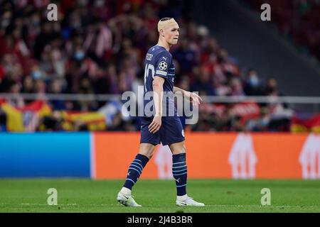 Madrid, Spain. 13th Apr, 2022. Phil Foden of Manchester City during the UEFA Champions League match, Quarter Final, Second Leg, between Atletico de Madrid and Manchester City played at Wanda Metropolitano Stadium on April 13, 2022 in Madrid, Spain. (Photo by Ruben Albarran/PRESSINPHOTO) Credit: PRESSINPHOTO SPORTS AGENCY/Alamy Live News Stock Photo