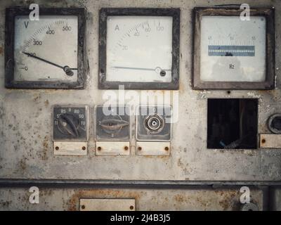 Close up shot of a rusty old large voltmeter and amperemeter. Stock Photo