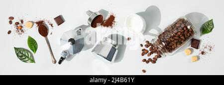 Coffee composition on light grey background with coffee arabica leaves, flat lay, banner Stock Photo