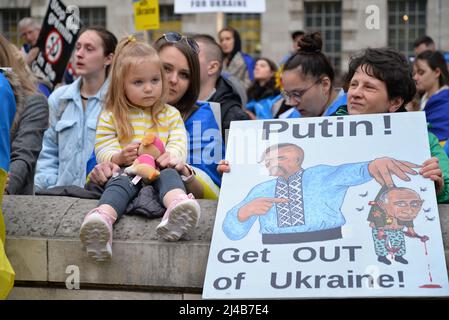 London, UK. 13th Apr, 2022. Across the road from Downing Street a large crowd, including many children,  protest against the Russian invasion of Ukraine. Whitehall, London, UK. 13th April 2022. Credit: Mark York/Alamy Live News Stock Photo