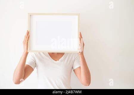 Wooden frames with empty space in the bedroom.  Stock Photo
