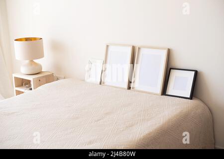 Wooden frames with empty space in the bedroom.  Stock Photo
