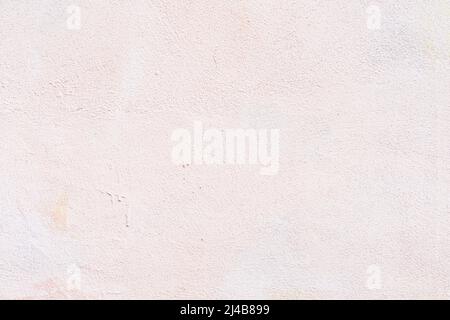 Pink painted concrete wall close-up, gentle pastel background Stock Photo