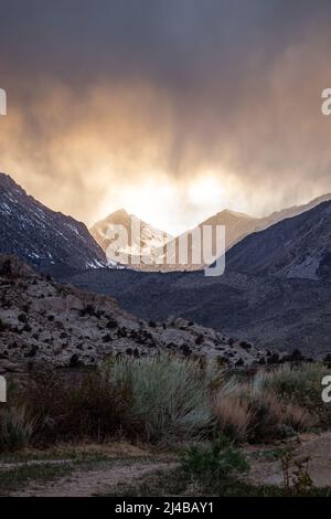 Storm clouds brewing over Lake Sabrina and the Buttermilks, east of Bishop CA Stock Photo