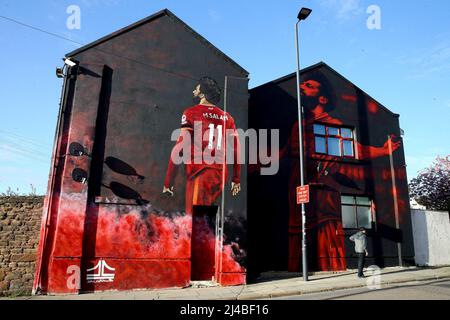 Liverpool, UK. 13th Apr, 2022. A mural of Liverpool FC player Mohamed Salah by artist John Culshaw on the side of a building on Anfield Road. UEFA Champions league, quarter-final 2nd leg match, Liverpool v Benfica at Anfield Stadium in Liverpool on Wednesday 13th April 2022. this image may only be used for Editorial purposes. Editorial use only, license required for commercial use. No use in betting, games or a single club/league/player publications. pic by Chris Stading/Andrew Orchard sports photography/Alamy Live news Credit: Andrew Orchard sports photography/Alamy Live News Stock Photo