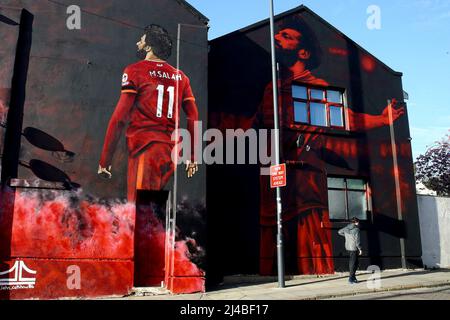 Liverpool, UK. 13th Apr, 2022. A mural of Liverpool FC player Mohamed Salah by artist John Culshaw on the side of a building on Anfield Road. UEFA Champions league, quarter-final 2nd leg match, Liverpool v Benfica at Anfield Stadium in Liverpool on Wednesday 13th April 2022. this image may only be used for Editorial purposes. Editorial use only, license required for commercial use. No use in betting, games or a single club/league/player publications. pic by Chris Stading/Andrew Orchard sports photography/Alamy Live news Credit: Andrew Orchard sports photography/Alamy Live News Stock Photo