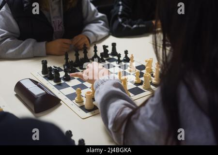 Two women playing chess on a tournament. Stock Photo