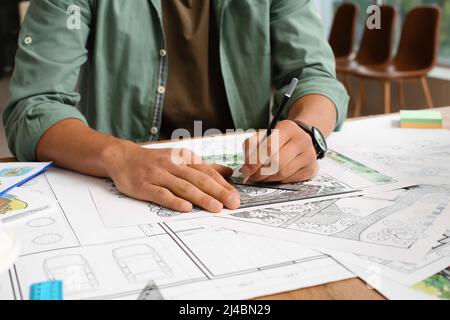 Young male landscape designer working in office Stock Photo