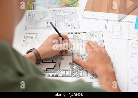 Young male landscape designer working in office Stock Photo
