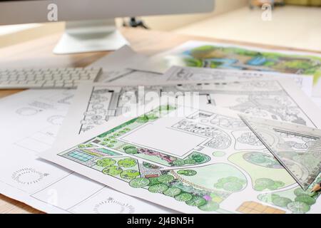 Landscape designer's projects on table in office Stock Photo