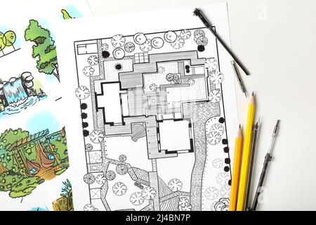 Paper sheets with sketches for landscape design and stationery on light background Stock Photo