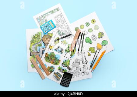 Paper sheets with sketches for landscape design and stationery on color background Stock Photo