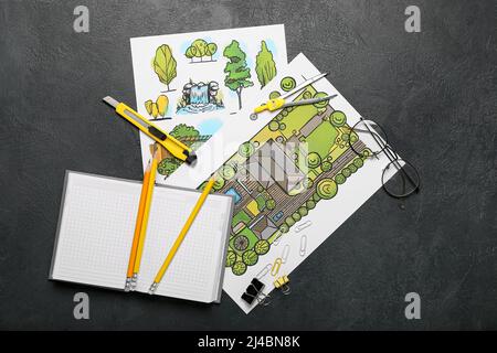 Paper sheets with sketches for landscape design and stationery on dark background Stock Photo