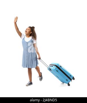 Going little African-American girl with suitcase on white background Stock Photo