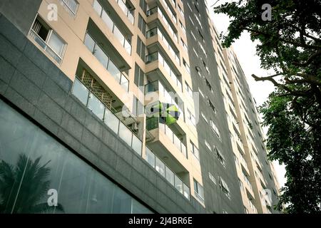 Ho Chi Minh City, Vietnam, April 12, 2022: A large parasol on the balcony of an apartment building in Ho Chi Minh City, Vietnam Stock Photo