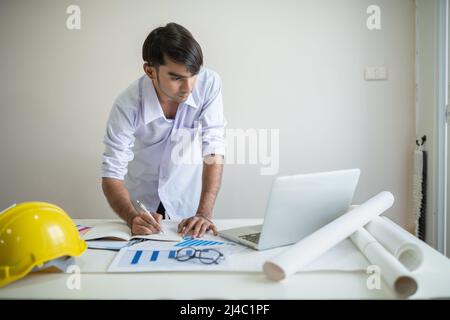Business man working with laptop and documents on his desk.analyzing data in office Stock Photo