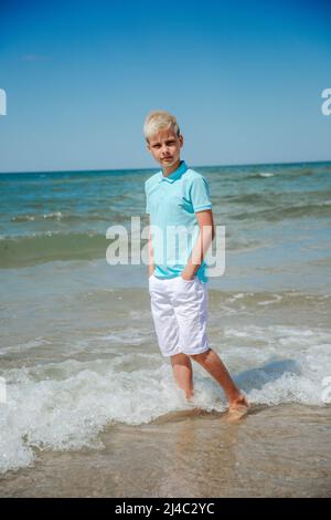 Teenager boy on summer vocation at the beach Stock Photo