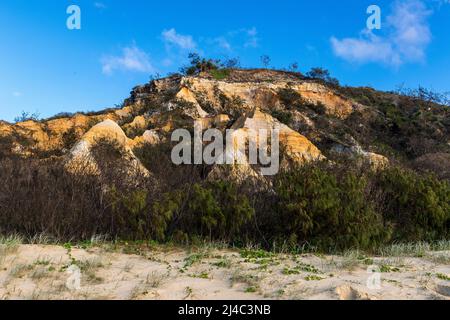 The Pinnacles are colourful sand dunes on the eastern coastline, along Seventy Five Mile Beach on Fraser Island, Queensland, Australia Stock Photo