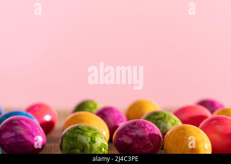 Scattered colored chicken eggs on linen fabric. Easter. Stock Photo