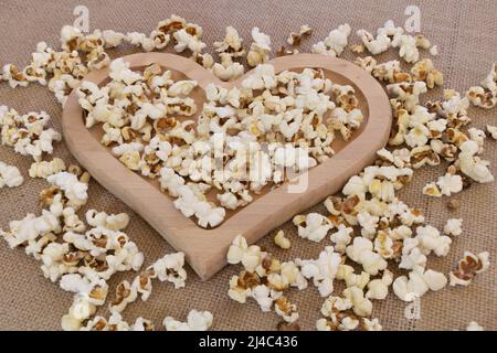 Close up shot of popcorn in a heart plate Stock Photo